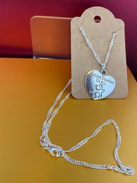 Silver necklace with Autism awareness message