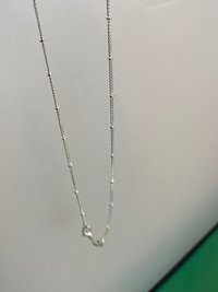 Silver necklace with Autism awareness message