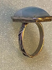 925 stamped square seal colour stone with filigree accents around the band