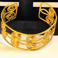 Gold toned scroll bracelet