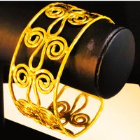 Gold toned scroll bracelet