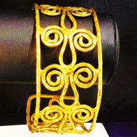Gold toned scroll bracelet