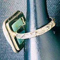 925 stamped square seal colour stone with filigree accents around the band
