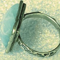 925 stamped square seal colour stone with filigree accents around the band
