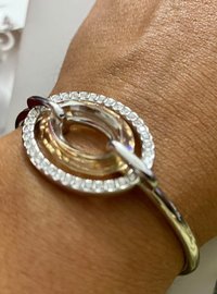 Authentic Swarovski Signed Logan Golden Shadow Bangle Bracelet and Rhodium-plated Circles Masquerade Pendant Pierced Earrings set.
