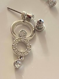 Authentic Swarovski Signed Logan Golden Shadow Bangle Bracelet and Rhodium-plated Circles Masquerade Pendant Pierced Earrings set.