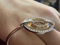 Authentic Swarovski Signed Logan Golden Shadow Bangle Bracelet and Rhodium-plated Circles Masquerade Pendant Pierced Earrings set.