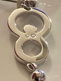 Authentic Swarovski Signed Logan Golden Shadow Bangle Bracelet and Rhodium-plated Circles Masquerade Pendant Pierced Earrings set.