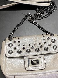 Bejeweled  Juicy Couture white with silver tone chain and dark stone
