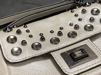 Bejeweled  Juicy Couture white with silver tone chain and dark stone