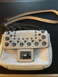Bejeweled  Juicy Couture white with silver tone chain and dark stone