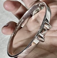 Silver tone Kate Spade “Take a Bow” bangle bracelet