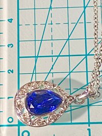 Vintage blue teardrop crystal halo NRT signed pendant on a silver chain with matching dangle earrings.