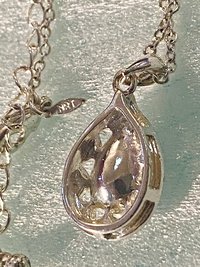 Vintage blue teardrop crystal halo NRT signed pendant on a silver chain with matching dangle earrings.