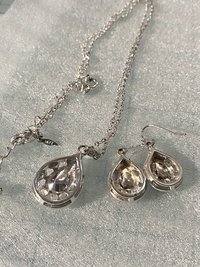 Vintage blue teardrop crystal halo NRT signed pendant on a silver chain with matching dangle earrings.