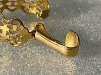 Gold tone thick Art Nouveau love scroll hoop earrings
