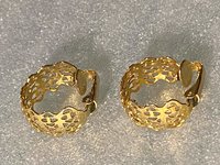 Gold tone thick Art Nouveau love scroll hoop earrings