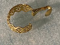 Gold tone thick Art Nouveau love scroll hoop earrings