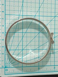 Silver tone Kate Spade “Take a Bow” bangle bracelet