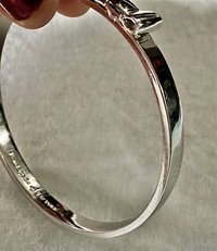 Silver tone Kate Spade “Take a Bow” bangle bracelet