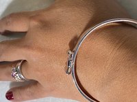 Silver tone Kate Spade “Take a Bow” bangle bracelet