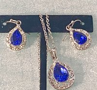 Vintage blue teardrop crystal halo NRT signed pendant on a silver chain with matching dangle earrings.
