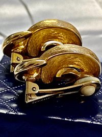 Vintage Gold tone 1980s Christian Dior high polished and textured clip on earrings.