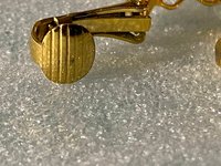 Gold tone thick Art Nouveau love scroll hoop earrings