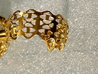 Gold tone thick Art Nouveau love scroll hoop earrings