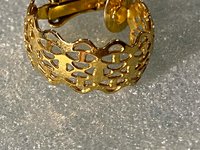 Gold tone thick Art Nouveau love scroll hoop earrings