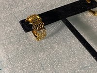 Gold tone thick Art Nouveau love scroll hoop earrings