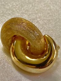 Vintage Gold tone 1980s Christian Dior high polished and textured clip on earrings.