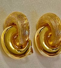 Vintage Gold tone 1980s Christian Dior high polished and textured clip on earrings.