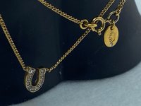 Rare authentic gold tone sparkly horseshoe  signed Juicy Couture