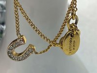 Rare authentic gold tone sparkly horseshoe  signed Juicy Couture