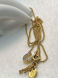 Rare authentic gold tone sparkly horseshoe  signed Juicy Couture