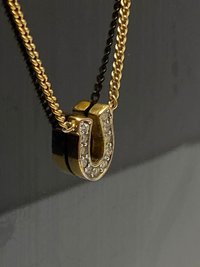 Rare authentic gold tone sparkly horseshoe  signed Juicy Couture