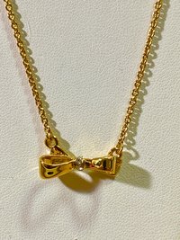 Kate Spade signed gold tone Bow pendant necklace