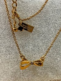 Kate Spade signed gold tone Bow pendant necklace
