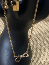 Kate Spade signed gold tone Bow pendant necklace