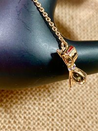 Kate Spade signed gold tone Bow pendant necklace