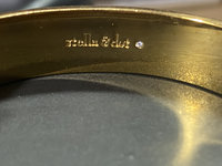 Gold tone with white enameled pattern Stella & Dot Bangle bracelet