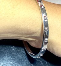 Kate Spade Silver tone studded bangle