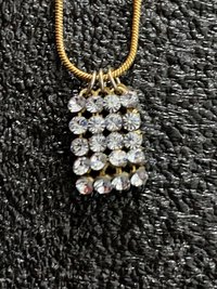 Swarovski crystals pendants signed on a gold tone Authentic