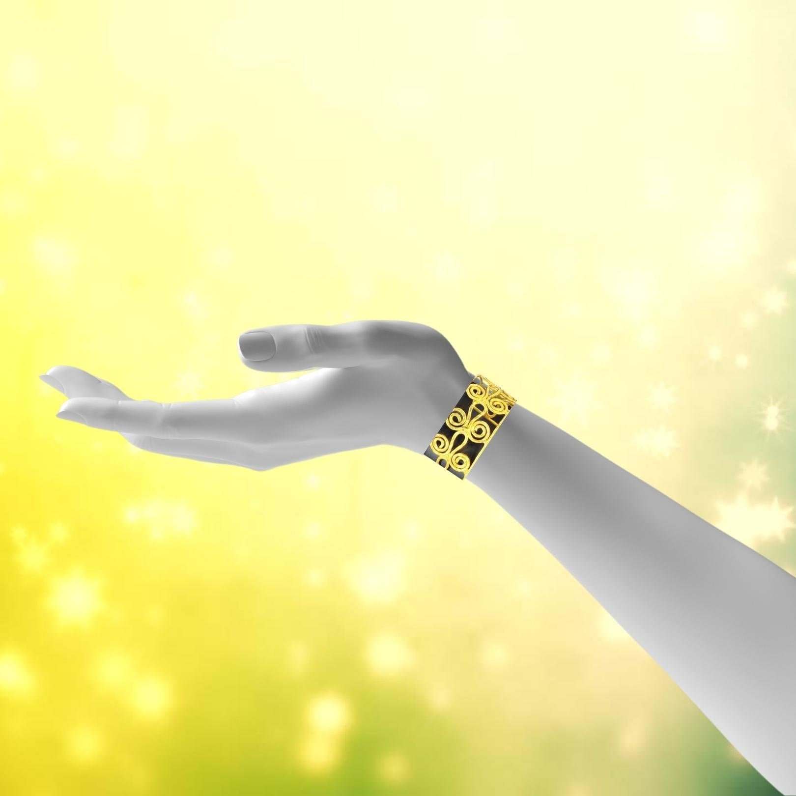 Gold toned scroll bracelet