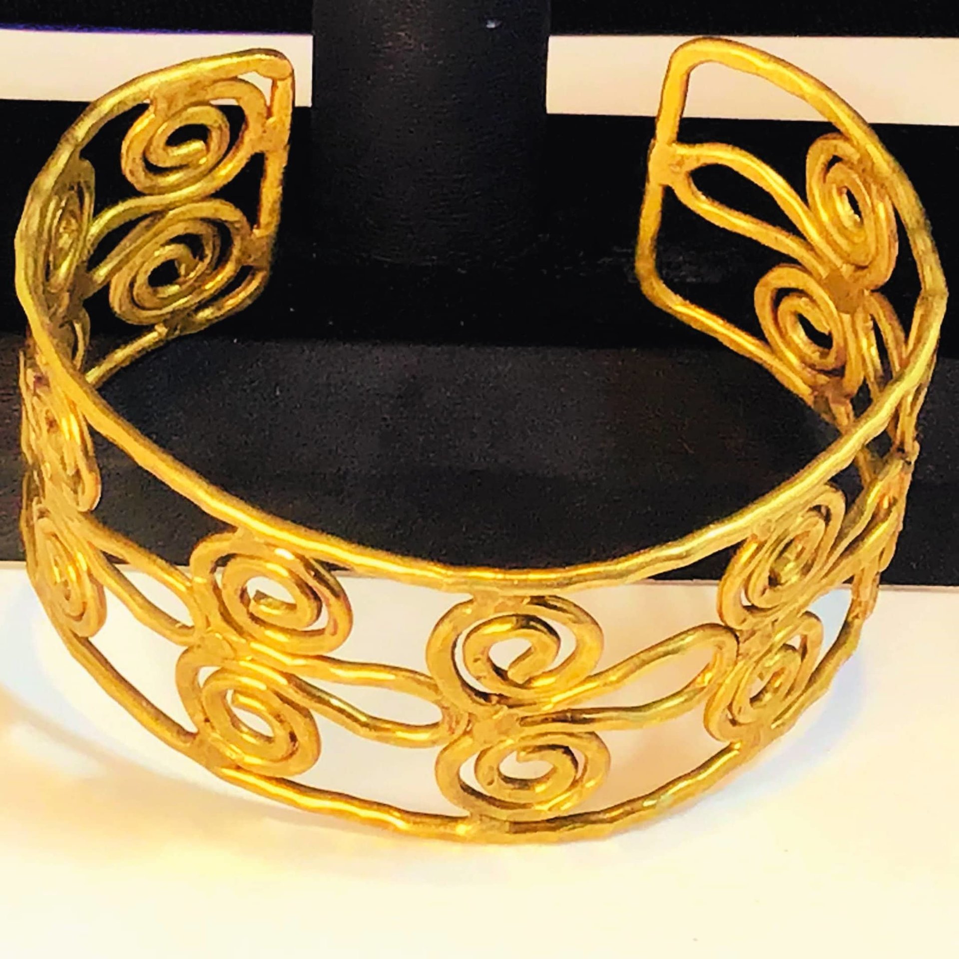 Gold toned scroll bracelet