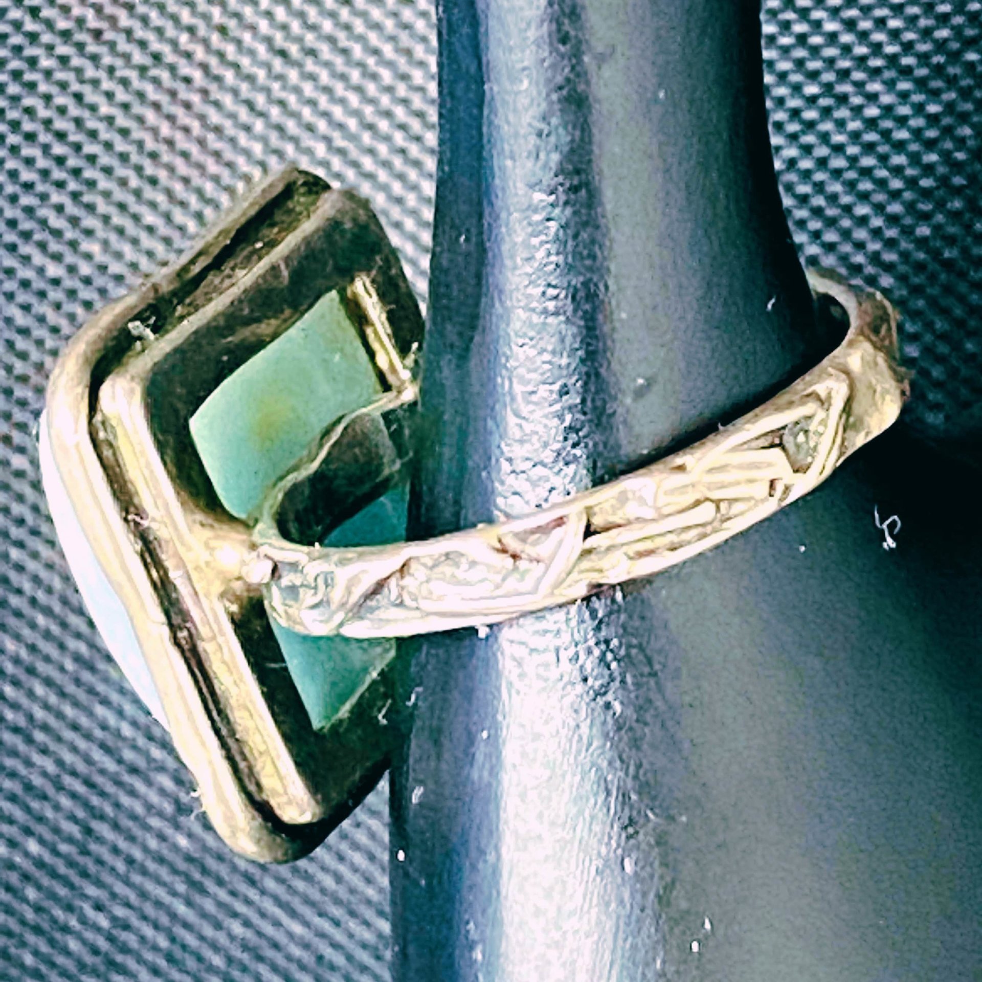 925 stamped square seal colour stone with filigree accents around the band