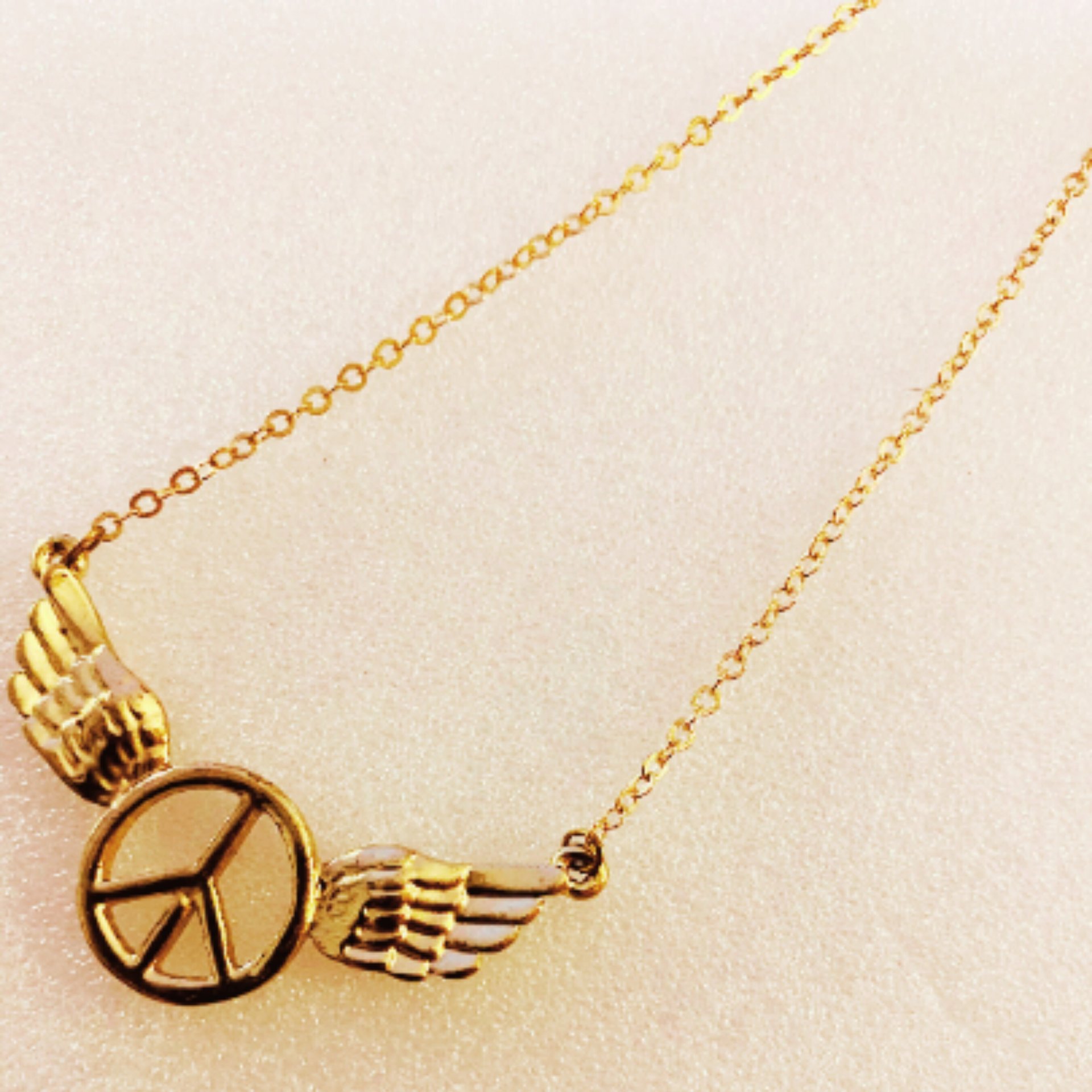 Gold Toned Wings Peace Sign Necklace