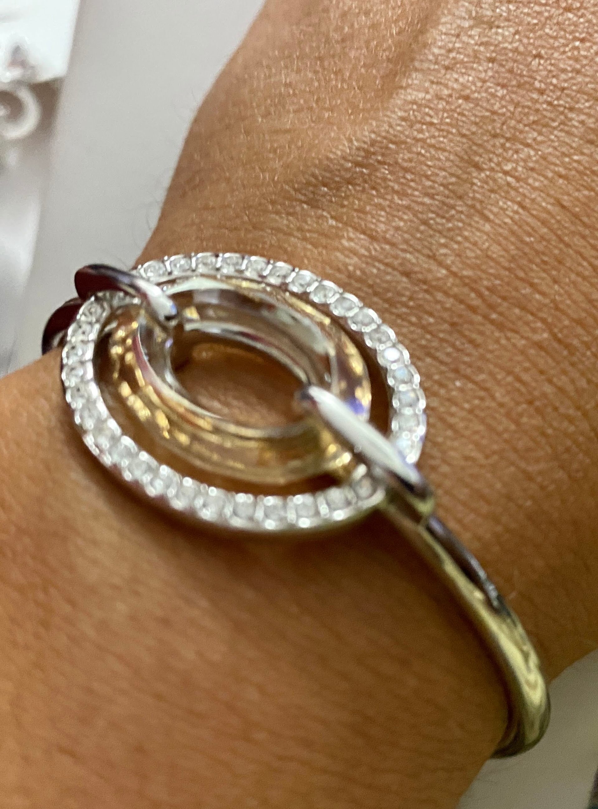Authentic Swarovski Signed Logan Golden Shadow Bangle Bracelet and Rhodium-plated Circles Masquerade Pendant Pierced Earrings set.