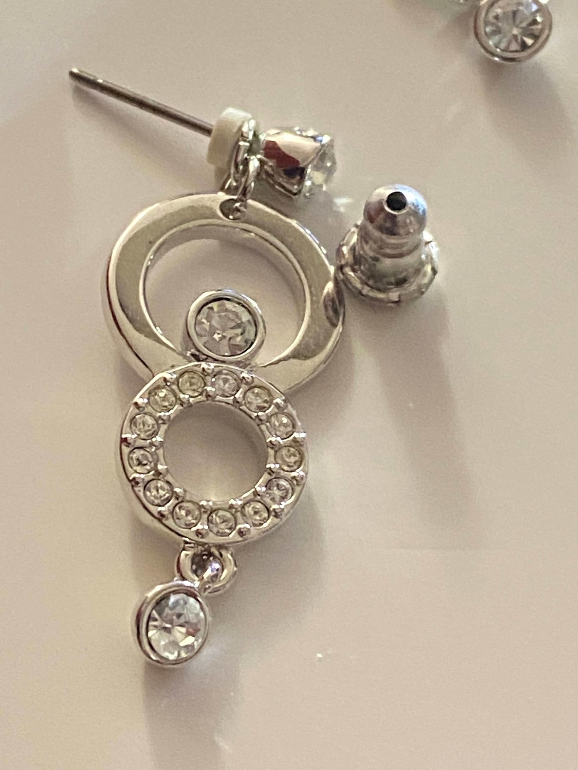 Authentic Swarovski Signed Logan Golden Shadow Bangle Bracelet and Rhodium-plated Circles Masquerade Pendant Pierced Earrings set.
